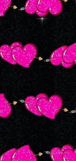 Pink glitter heart balloons on a black background wallpaper.