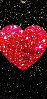 Dazzling red glitter heart on a sparkling black background.