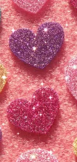 Mobile wallpaper with glittery colorful hearts on a pink background.