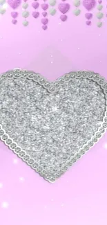 Sparkling glitter heart on light pink background mobile wallpaper.