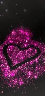 Pink glitter heart on black background wallpaper.