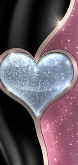 Glittery heart on pink and black background.