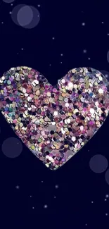 Heart-shaped glitter design on a deep blue background.