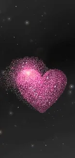 Pink glittering heart on dark starry background.