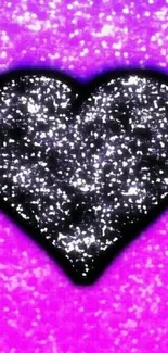 Black glitter heart on purple background wallpaper.