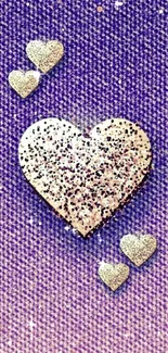 Glitter hearts on a purple gradient wallpaper.