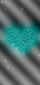 Teal glitter heart on black gradient background.