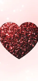 Sparkling red glitter heart on a soft pink background wallpaper.