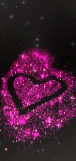 Magenta glitter heart on black background.