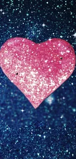 Sparkling pink heart on a glittery blue background wallpaper.