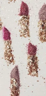 Glittery lipstick visual in pink and gold tones.