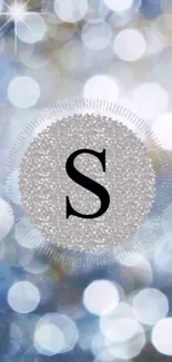 Shimmering silver monogram wallpaper with bokeh effect and letter S.