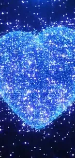 A glittering blue heart with sparkling lights on a dark background.