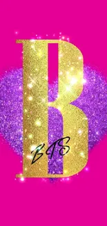 Glittering gold letter B on pink with purple heart.