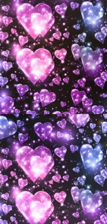 Glittering pink and purple heart galaxy wallpaper for mobile.