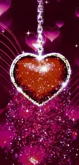 Glittering heart with pink sparkling background wallpaper.