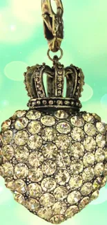 Diamond-studded heart with crown on pastel green background.