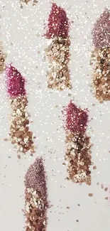 Pink and gold glitter lipstick pattern on off-white background.