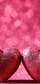 Glittering pink hearts with bokeh background.