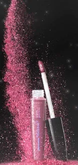 Pink glitter lip gloss with sparkling particles on black background.