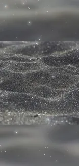 Gray glittering sand texture, perfect for mobile wallpaper.