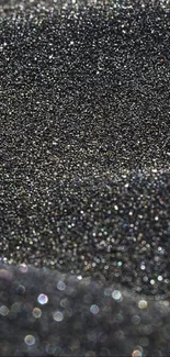 Black and gold glittering sand texture wallpaper for mobile screen.