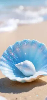 A sparkling blue seashell rests on a sandy beach.