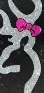 Glitter deer silhouette with pink bow on black background.