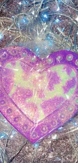 Glittery purple heart with fairy lights background.