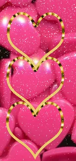 Three glittery hearts with golden outlines on a pink background.