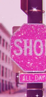 Sparkly pink street sign with 'Shop All Day' in an urban setting.