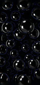 Glossy black spheres on a dark abstract wallpaper.