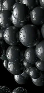 Glossy black bubbles on a dark background, creating a sleek and modern phone wallpaper.