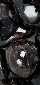 Glossy clustered black gemstones mobile wallpaper.