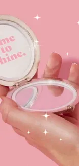 Hand holding a pink vintage mirror with 'time to shine' text.