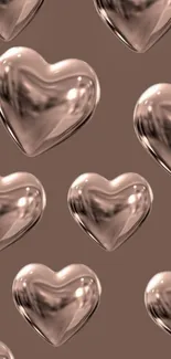 Glossy 3D hearts on a brown background mobile wallpaper.