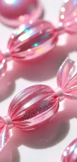 Glossy pink candy wallpaper with iridescent details.