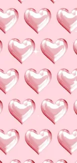 Glossy pink hearts on a light pink background.