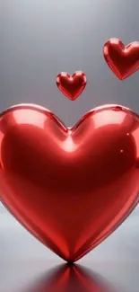 Glossy red hearts on a sleek background.