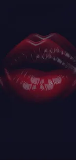 Close-up of glossy red lips on a black background.