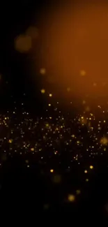 Abstract wallpaper with glowing golden particles on a black background.