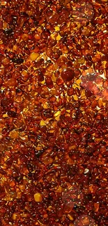 Vibrant amber gemstones pattern wallpaper with warm orange hues.