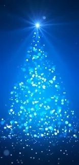 Glowing blue Christmas tree with sparkling lights on a dark background.