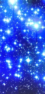 Glowing blue starry sky with bright stars scattered across the dark background.