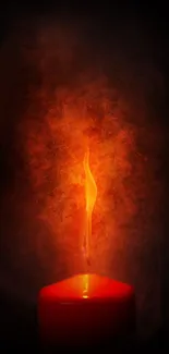 Mobile wallpaper of a glowing red candle flame on a dark background.