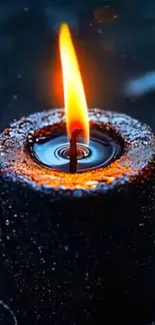 A glowing candle in a dark setting creating a serene ambiance.