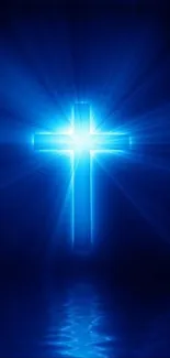 Blue glowing cross with radiant light on a dark background.