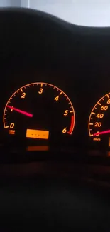 Glowing car dashboard with illuminated gauges.