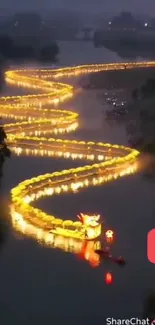 Dragon-shaped glowing installation on a river at night.