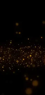 Glowing golden sparkles on a dark background mobile wallpaper.